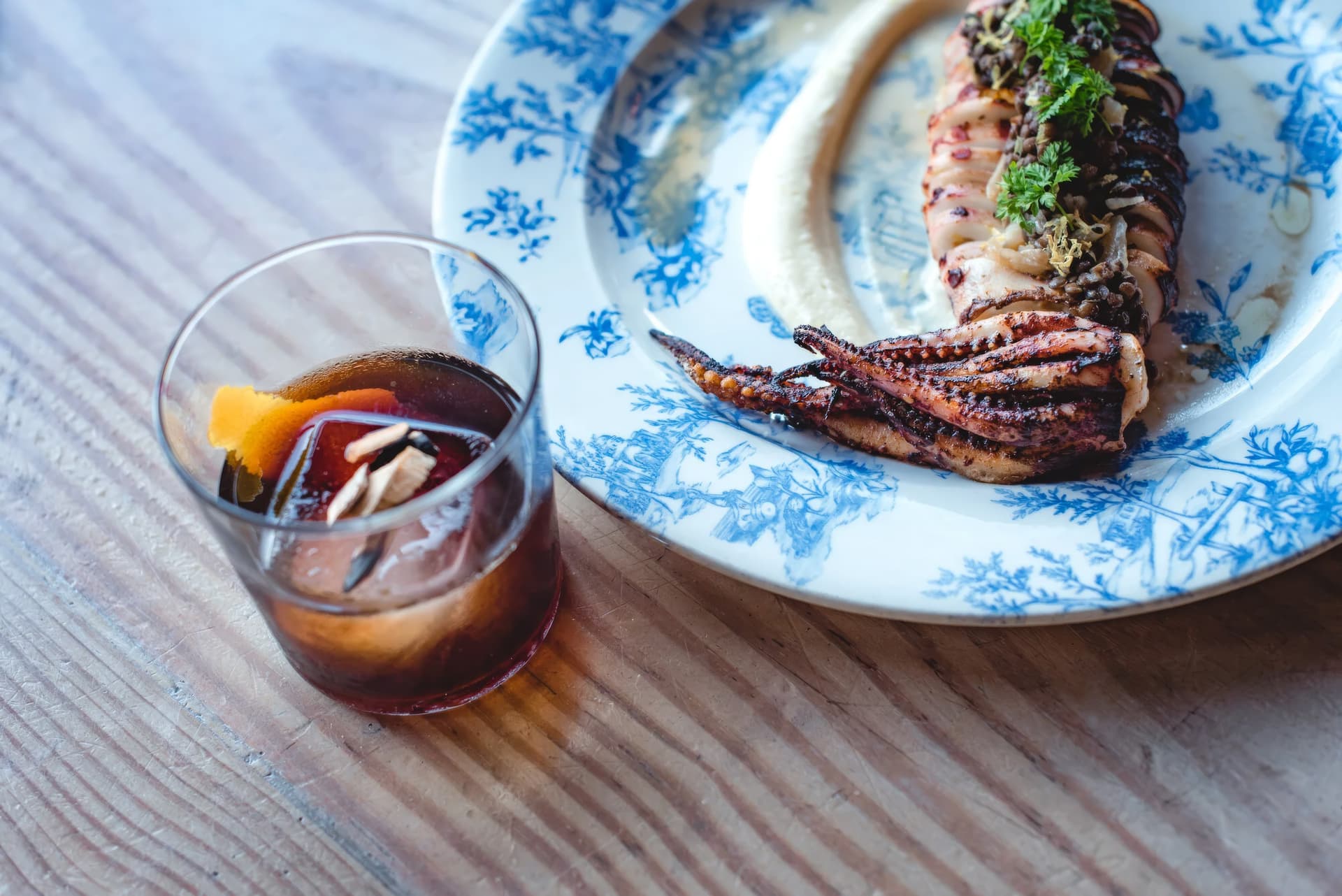 Grilled squid and a cocktail at Barceloneta
