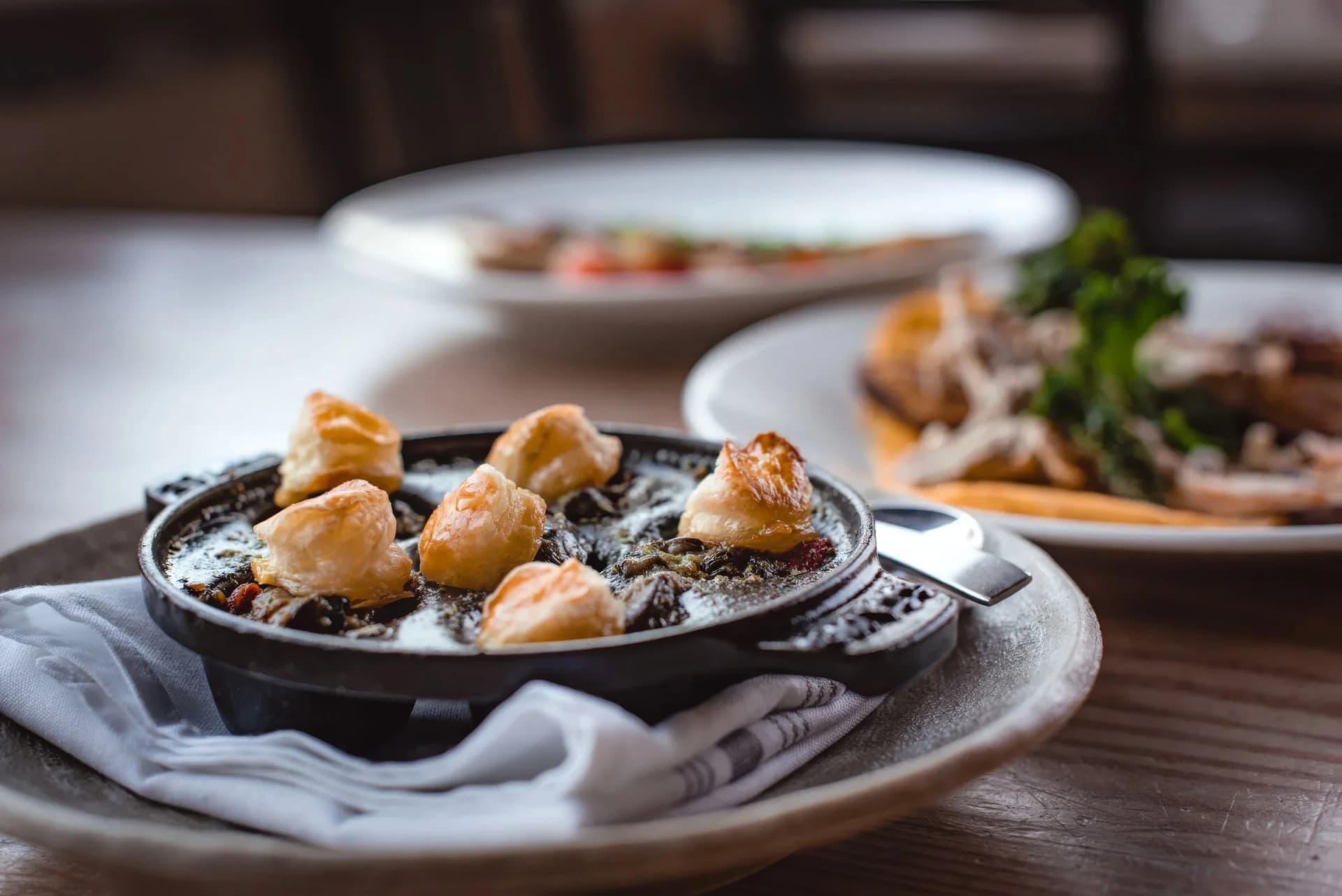A skillet of tapas on the table at Barceloneta