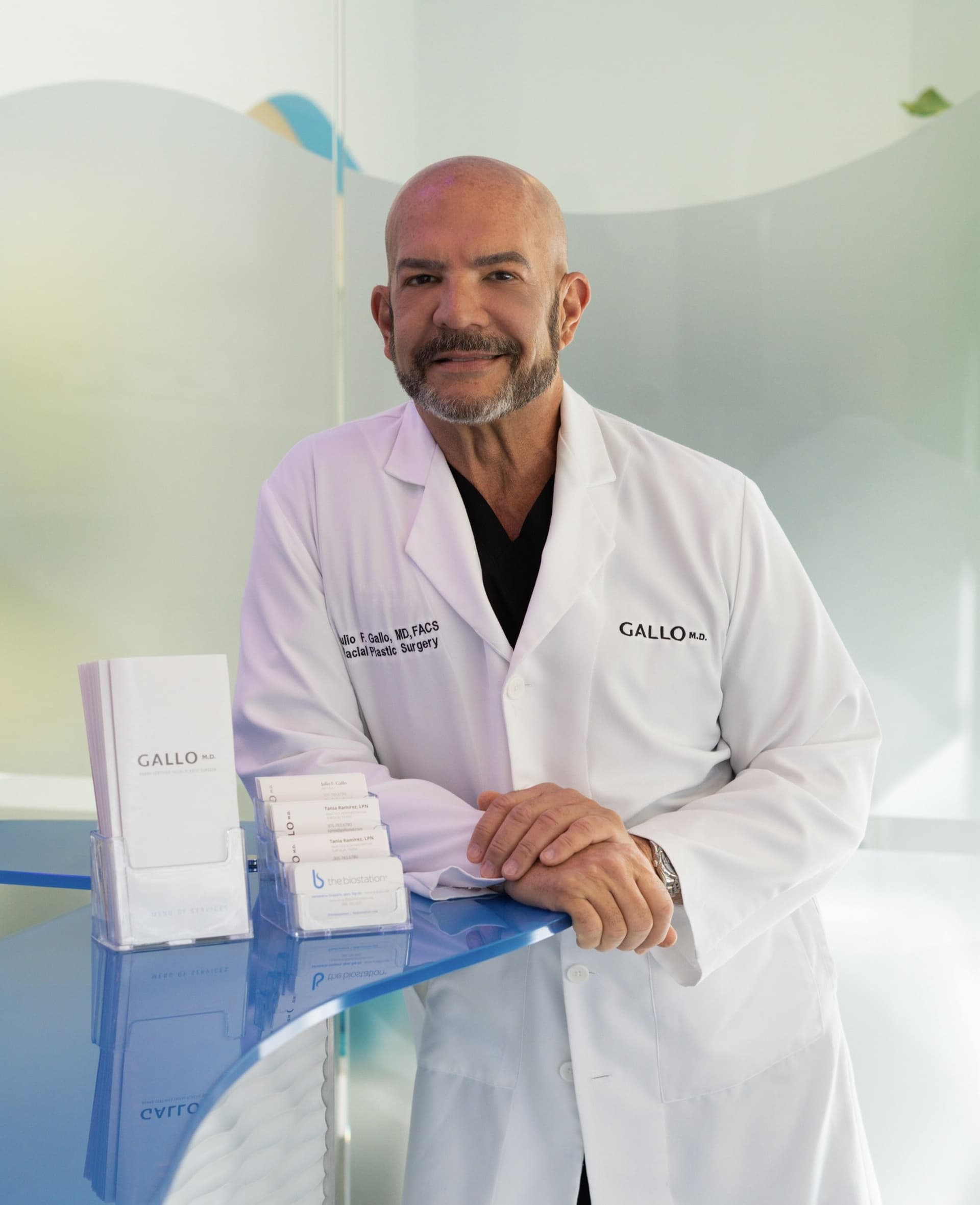 Dr. Julio Gallo at the front desk of Gallo MD in Midtown Miami