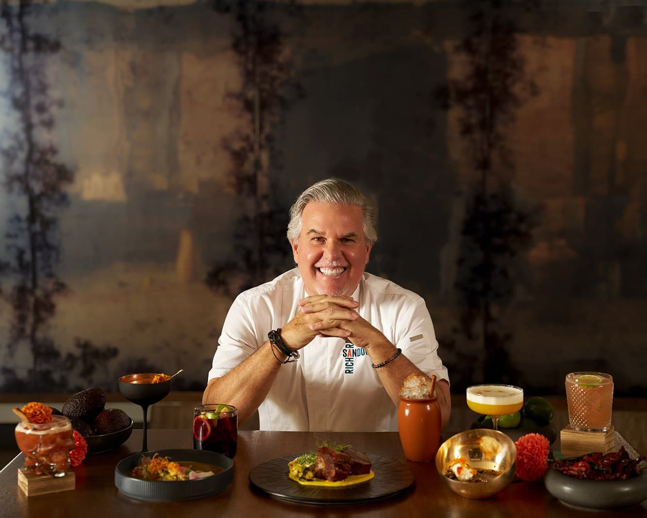Chef Richard Sandoval with Día de los Muertos dishes at Toro Toro